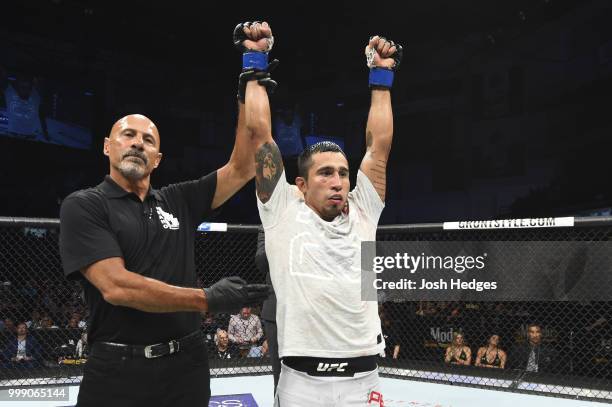 Alejandro Perez of Mexico celebrates his decision victory over Eddie Wineland in their bantamweight fight during the UFC Fight Night event inside...