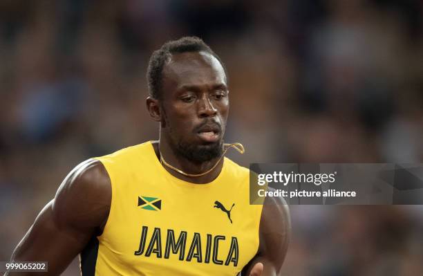 Sprinter Usain Bolt of Jamaica can be seen at the final race of the 4 x 100 metres relay at the IAAF London 2017 World Athletics Championships in...