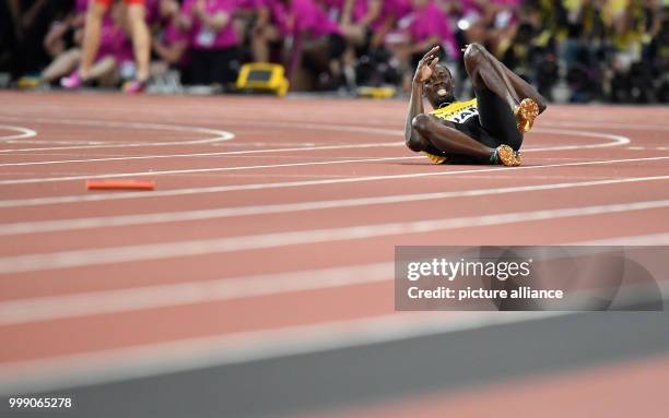 Sprinter Usain Bolt of Jamaica can be seen at the final race of the 4 x 100 metres relay at the IAAF London 2017 World Athletics Championships in...