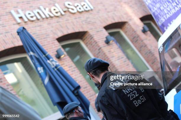 Police officer stands in front of the Henkel-Saal, where the members of the German party Alternative fuer Deutschland hold their federal...