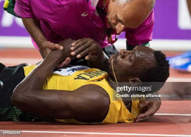 Sprinter Usain Bolt of Jamaica can be seen at the final race of the 4 x 100 metres relay at the IAAF London 2017 World Athletics Championships in...