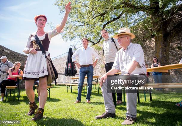 Picture of tourist guide Petra Buchmann guiding Winfried Kretschmann, Premier of the state of Baden-Wurttemberg, through Hohenneuffen Castle during...