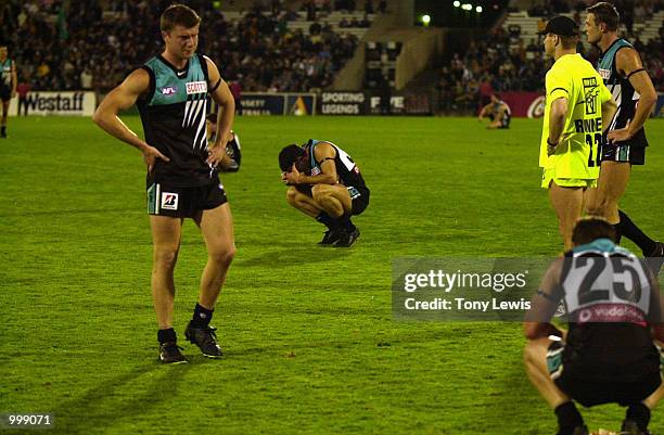 Port Adelaide players react after Hawthorn won the semi final match between Port Power and the Hawthorn Hawks played at Football Park in Adelaide,...