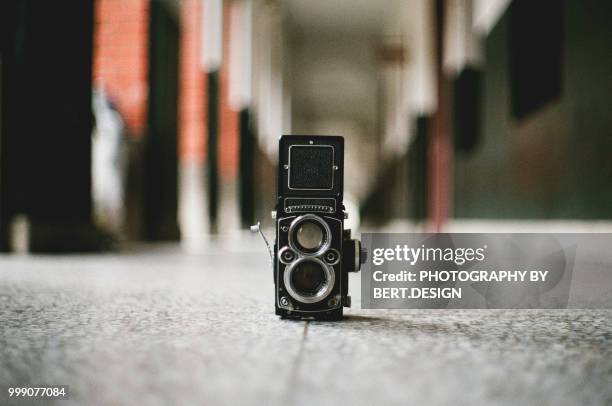 a vintage medium format camera on the floor - medium format stock pictures, royalty-free photos & images