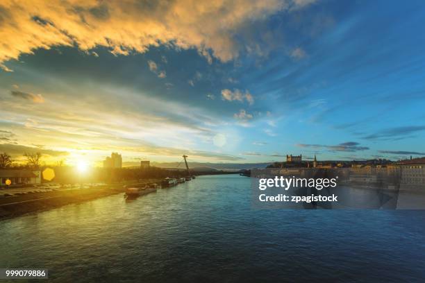 bratislava cityscape with the danube river and snp bridge at sunset - cable stayed bridge stock pictures, royalty-free photos & images