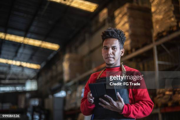 man working at a warehouse - dream deliveries stock pictures, royalty-free photos & images