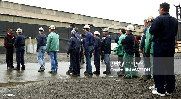 President Barack Obama shakes hands with employees as he tours through V & M Star, a leading producer of seamless pipe for the oil and gas industry,...