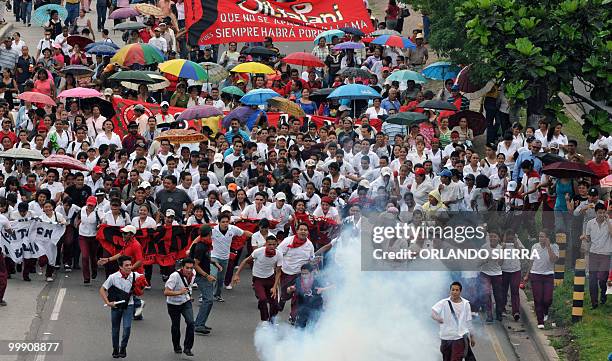 Honduran teachers, students and members of the National Front of Popular Resistance march in support of the teachers' statute, in Tegucigalpa, on May...