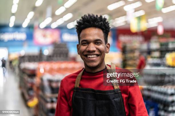 supermarket salesman portrait - retail assistant stock pictures, royalty-free photos & images