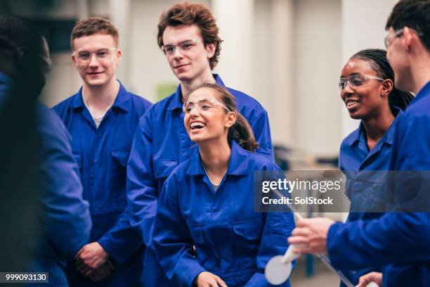 enjoying engineering class - apprentices stock pictures, royalty-free photos & images