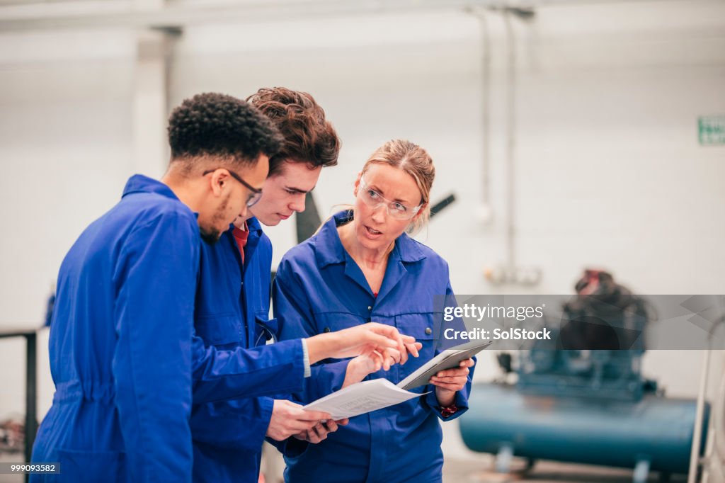 Engineering Tutor Discussing Ideas With Their Engineering Tutor High-Res Stock Photo ...