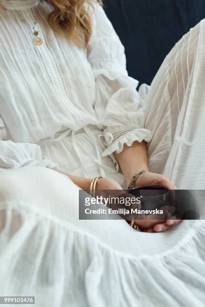 close up of a young woman wearing boho dress - emilija manevska stock-fotos und bilder