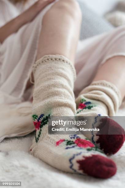 female legs in knitted socks - emilija manevska stock-fotos und bilder