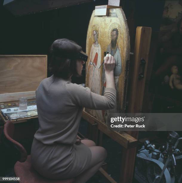 Art conservator Sheila Spencer restoring 'Saints Catherine and Bartholomew' painting by Allegretto Nuzi and Francescuccio Ghissi at the National...