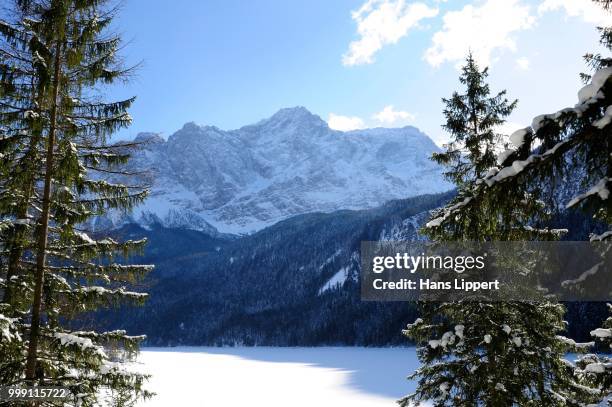 view over the frozen eibsee lake on mt. zugspitze, grainau, werdenfelser land county, upper bavaria, bavaria, germany - werdenfelser land stock pictures, royalty-free photos & images