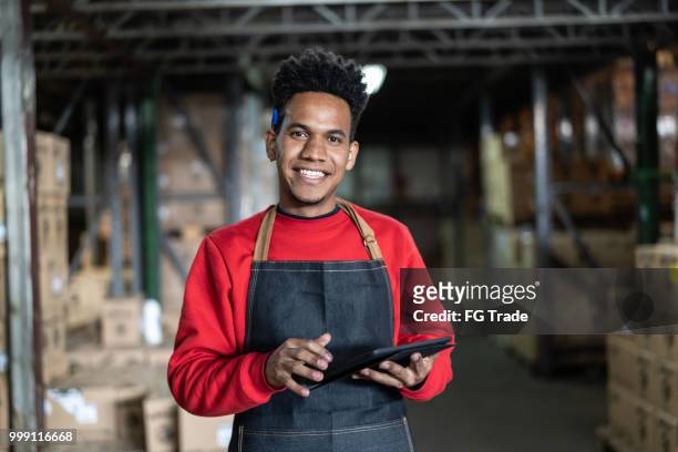 man working at a warehouse - brazilian stock exchange stock pictures, royalty-free photos & images