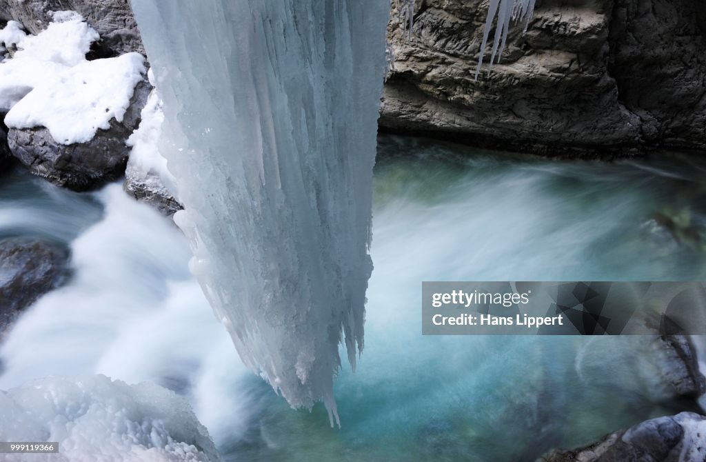 Icicles over running water in the Partnachklamm gorge at Garmisch-Partenkirchen, Werdenfelser Land region, Upper Bavaria, Bavaria, Germany