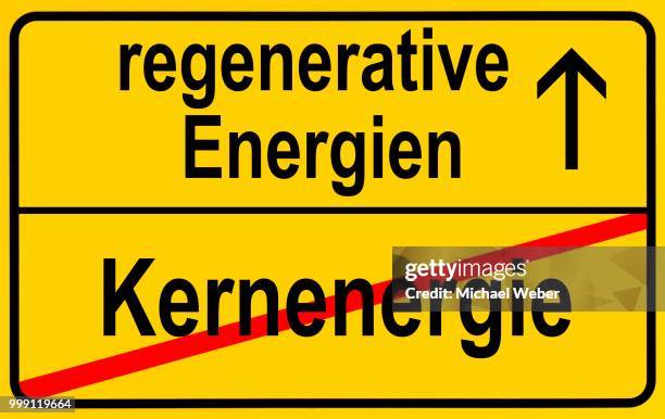 symbolic image in the form of a town sign, in german, exit from nuclear energy, entrance into regenerative energy sources - regenerative stock illustrations