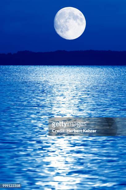 composing, moon over lake chiemsee, bavaria, germany - contre jour stock-fotos und bilder