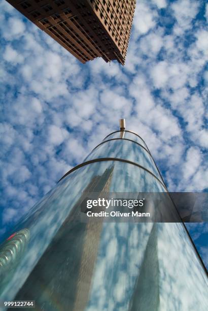 light tube and kollhoff tower at potsdamer platz square, berlin, germany - platz stock pictures, royalty-free photos & images