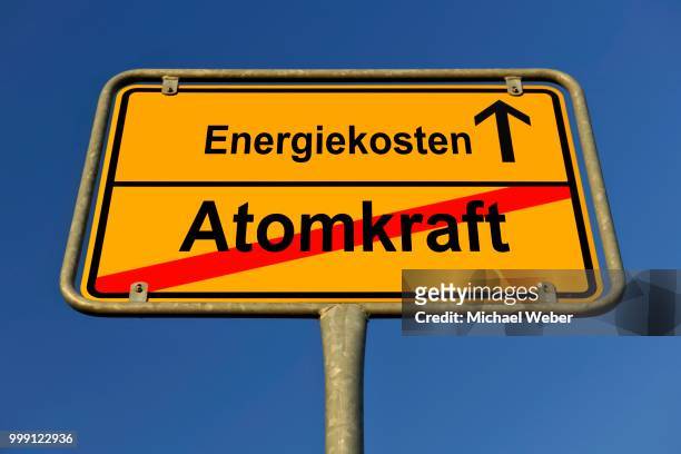 city limit sign, symbolic image in german for phasing out nuclear power stations and rising energy costs, electricity prices - anti nuclear demonstration stock pictures, royalty-free photos & images