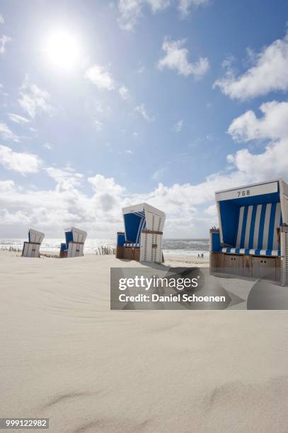 roofed wicker beach chairs on the beach in westerland, sylt island, schleswig-holstein, germany - contre jour stock-fotos und bilder