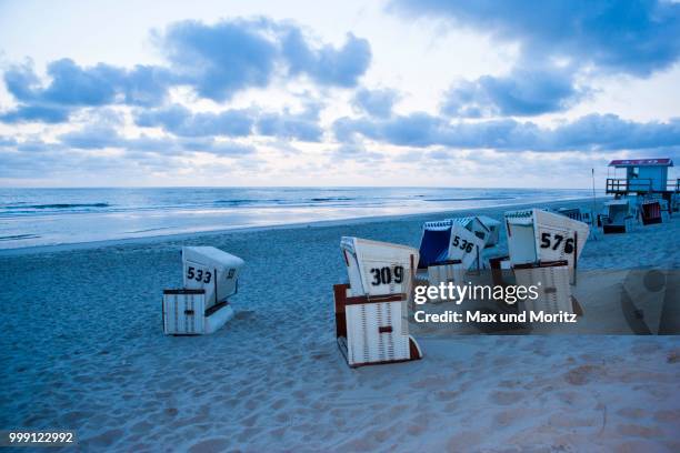 roofed wicker beach chairs, sansibar, sylt island, north frisian islands, germany - touristical stock pictures, royalty-free photos & images
