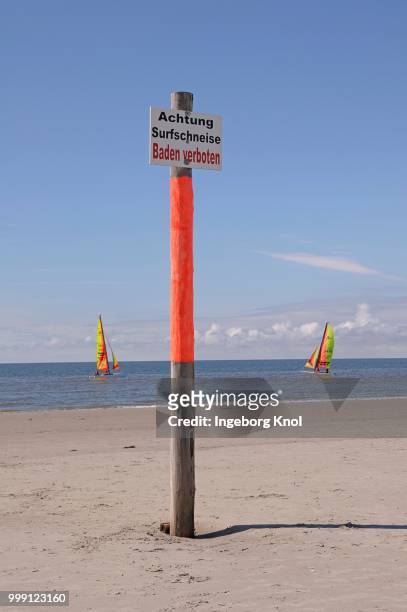 sign, achtung surfschneise, baden verboten, german for caution surf break, bathing is prohibited, in front of windsurfers at a beach, north sea, st. peter-ording, schleswig-holstein, germany - indication stock pictures, royalty-free photos & images