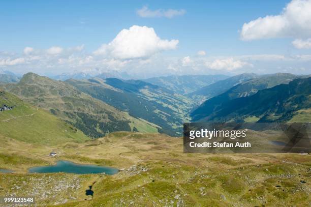 looking towards lengau in the valley seen from gamshag mountain, 2178 m, with hochtorsee lake in the foreground, kitzbuehel alps, saalbach-hinterglemm, salzburg, austria - north tirol stock pictures, royalty-free photos & images