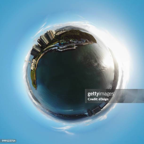sphere panoramic view of highrise buildings on island in city with well equipped infrastructure and sea - 360 globe stockfoto's en -beelden