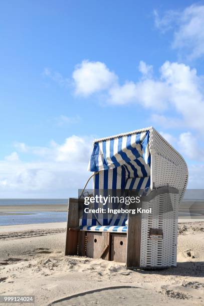 canopied beach chair on the north sea coast, wyk auf foehr, schleswig-holstein, germany - auf stock pictures, royalty-free photos & images