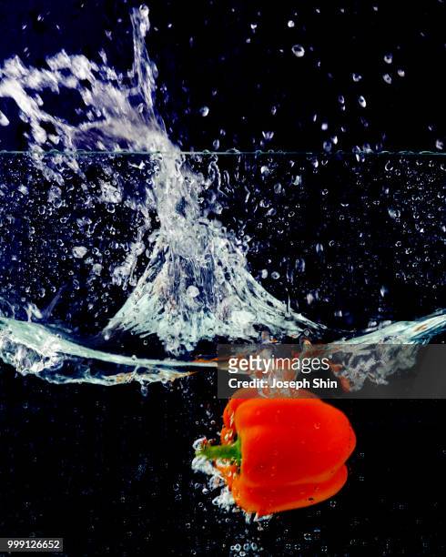 a fruit in the water - pepper spray stockfoto's en -beelden