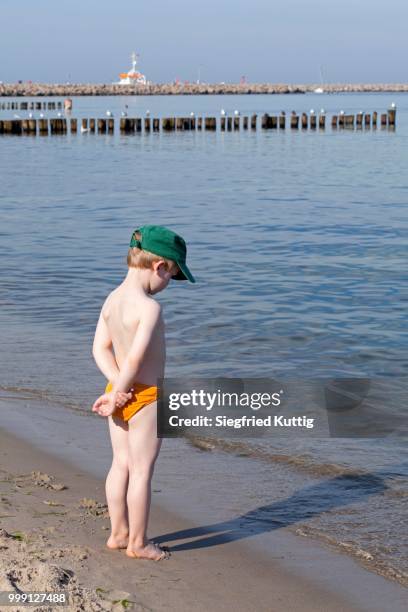 young boy on the beach, kuehlungsborn, mecklenburg-western pomerania, germany - touristical stock pictures, royalty-free photos & images