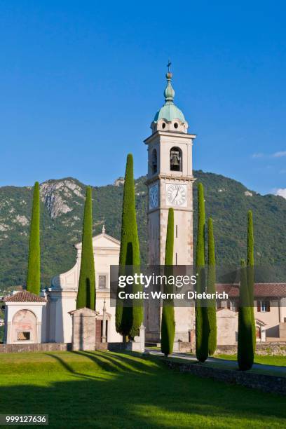 church of sant abbondio, cypress-lined road, in gentilino, ticino, switzerland - sant�� stock-fotos und bilder