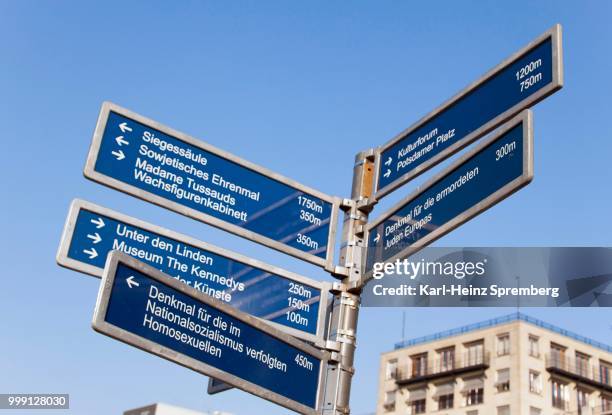 signpost at the brandenburg gate, city centre, berlin, germany - touristical stock pictures, royalty-free photos & images