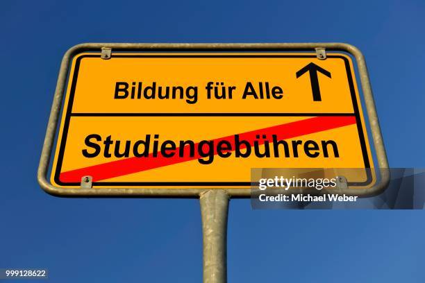 city limits sign with the words bildung fuer alle and studiengebuehren, german for education for everybody and tuition fees, symbolic image for the abolition of tuition fees to enable the right to education for all - lageplan stockfoto's en -beelden