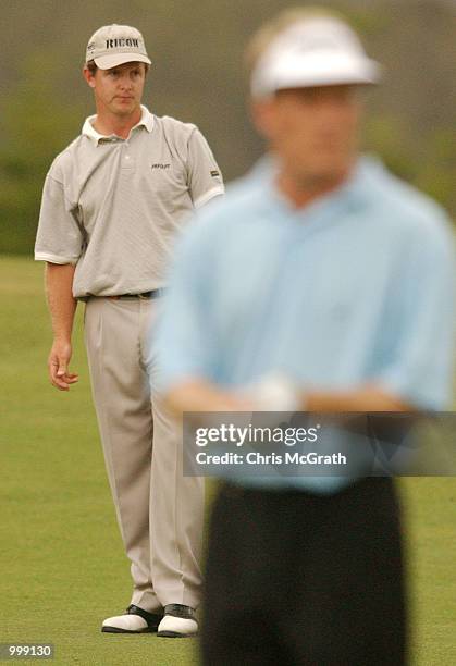 Scott Laycock of Australia looks on with eventual winner Stuart Appleby of Australia during the final round of the Holden Australian Open Golf...