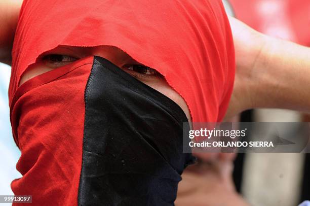 Honduran students demonstrates in support of the teachers' statute, in Tegucigalpa, on May 18, 2010. Protestors fear the derogation of the statute...