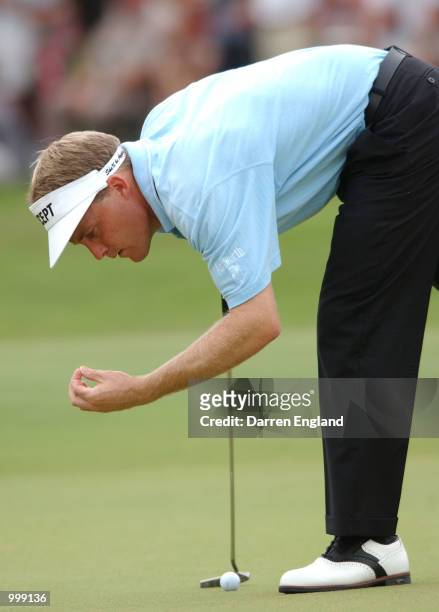 Stuart Appleby of Australia makes a clear path for his putt on the 12th green during the Holden Australian Open Golf Tournament held at The Grand...