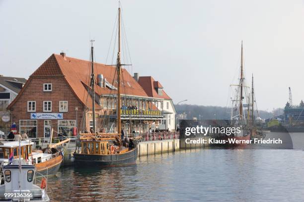 kluever#s brauhause, restaurant, former fish factory at the harbour with sailboats and harbour, neustadt, holstein, schleswig-holstein, germany - werner stock pictures, royalty-free photos & images