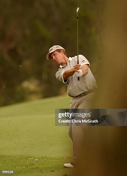 Scott Laycock of Australia hits an approach shot on the 13th hole during the final round of the Holden Australian Open Golf Tournament held at The...