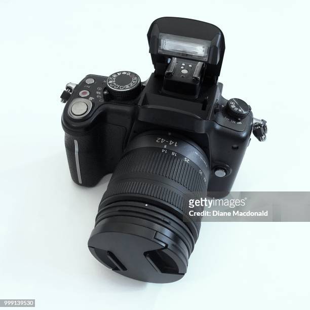 a dslr camera - spiegelreflexcamera stockfoto's en -beelden