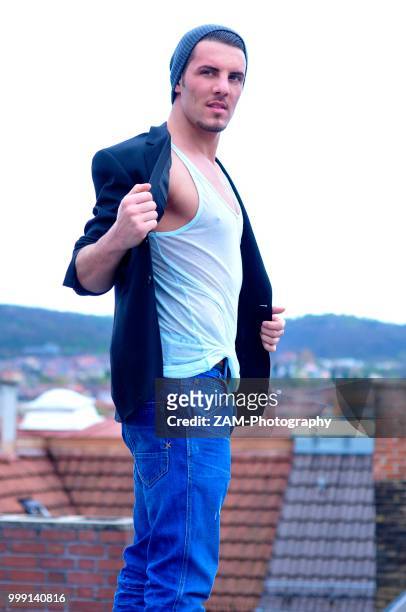 young italian man above the rooftops of stuttgart, baden-wuerttemberg, germany - posessions stock pictures, royalty-free photos & images