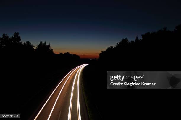 light trails, dusk, highway, federal road b30, near biberach, upper swabia, baden-wuerttemberg, germany - road light trail stock pictures, royalty-free photos & images