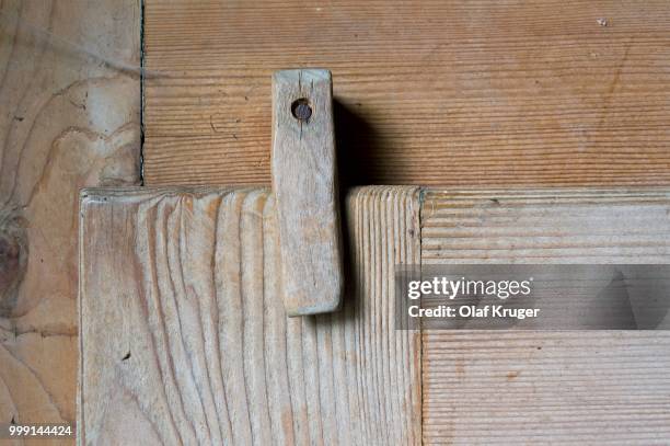 wooden latch on rustic style cupboard, stuttgart, baden-wuerttemberg, germany - latch stock pictures, royalty-free photos & images