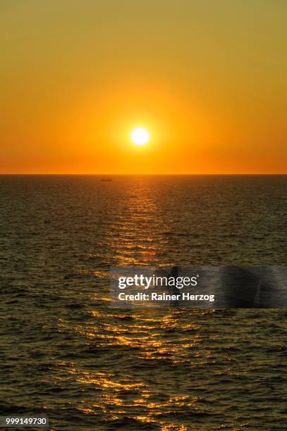 sunset over the baltic sea, germany - herzog stockfoto's en -beelden