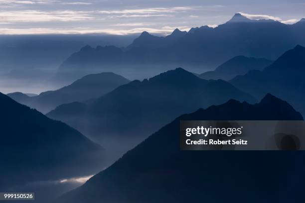 blue hour with mountain peaks of the ammer mountains, mt. zugspitze at the back, reutte, ausserfern, tyrol, austria - wetterstein mountains stock pictures, royalty-free photos & images