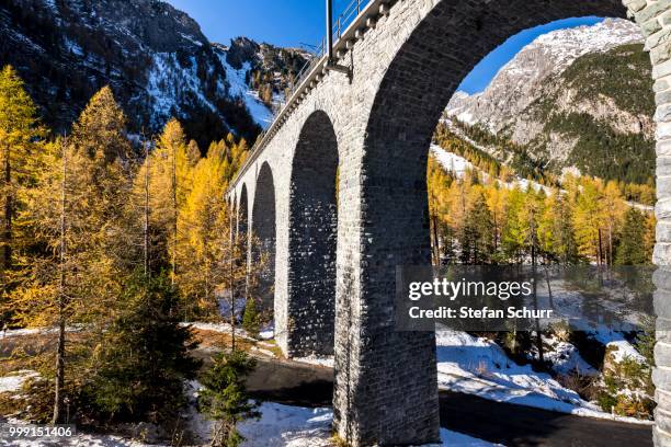 railway bridge, albula pass road, autumn, albula valley, canton of graubuenden, switzerland - graubunden canton stock-fotos und bilder