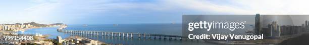 xinghai bay bridge hilltop view - vijay stock pictures, royalty-free photos & images