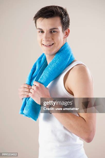 smiling young man after doing sport, mannheim, baden-wuerttemberg, germany - undershirt stock pictures, royalty-free photos & images